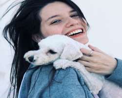 She has a furry friend in her home. She named the dog Yastin. Her dog feels comfortable and safe while being with her.